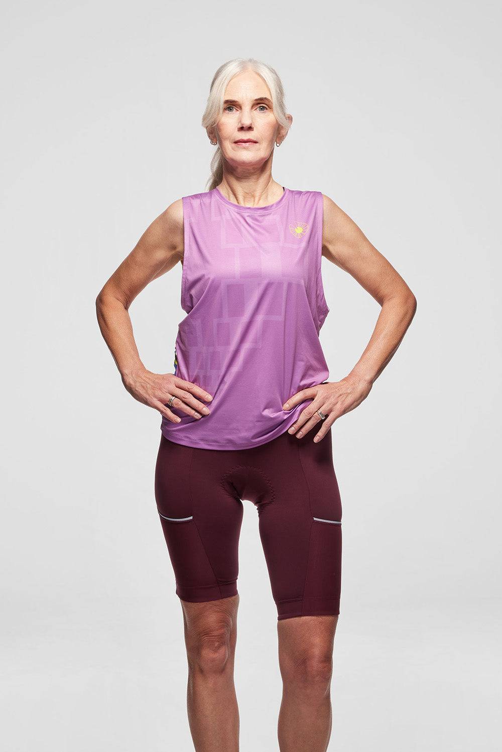 Model is wearing a size S tank top and M bib short